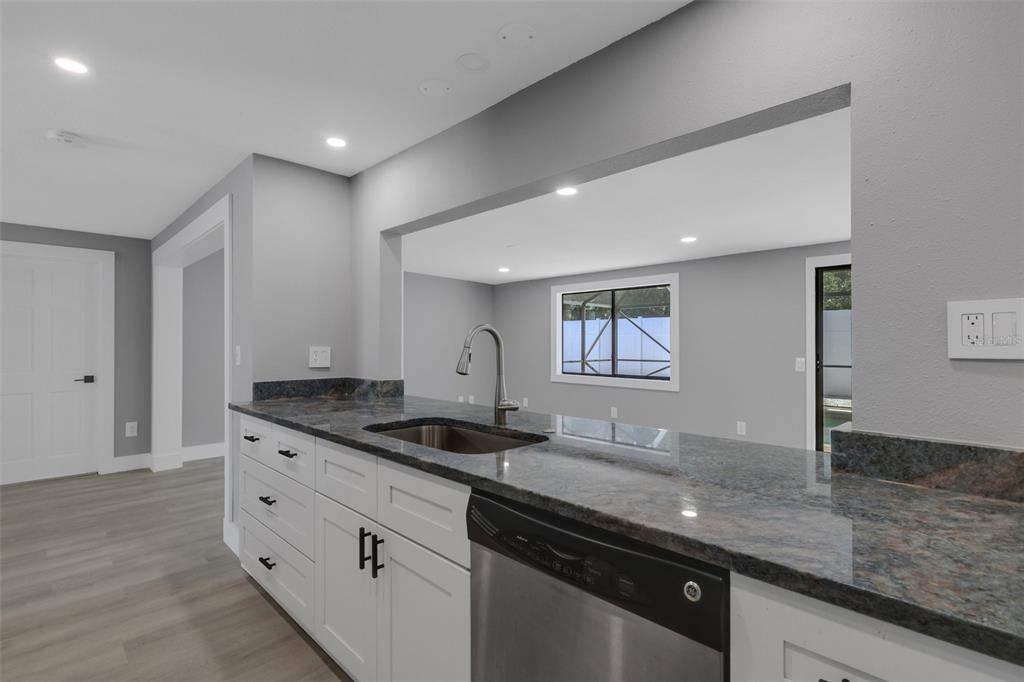 4645 Hunter Ridge Drive Sarasota, FL 34233 - Photo 23 of 70 a kitchen with granite countertop a sink and a granite counter tops