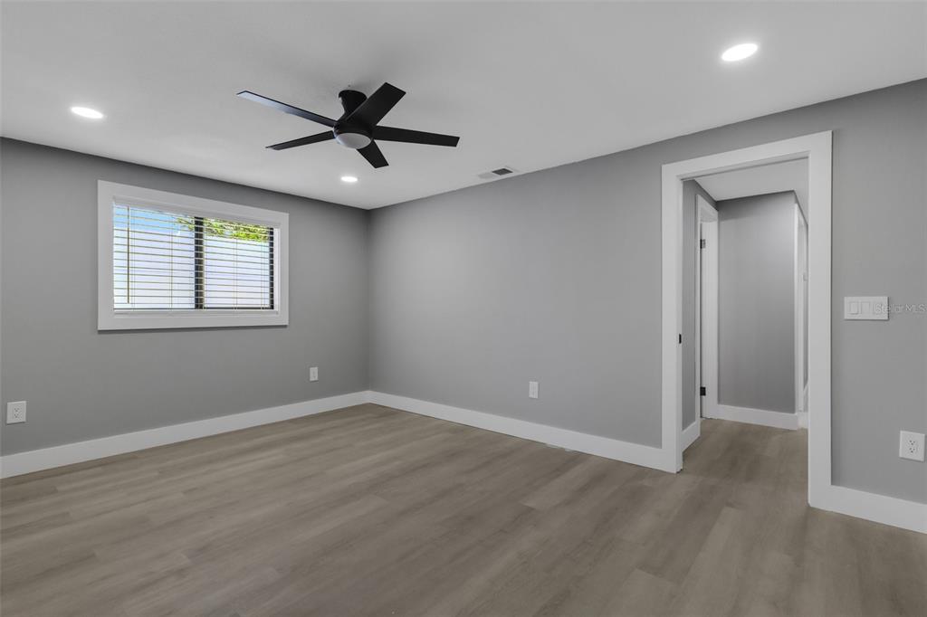 4645 Hunter Ridge Drive Sarasota, FL 34233 - Photo 41 of 70 wooden floor in an empty room with a window