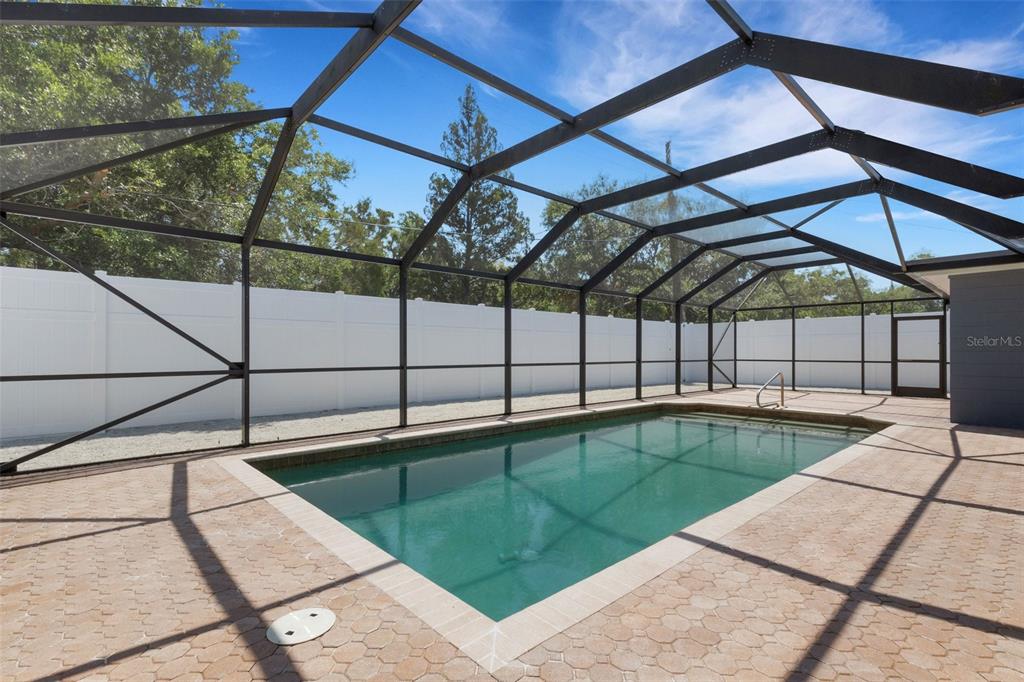 4645 Hunter Ridge Drive Sarasota, FL 34233 - Photo 61 of 70 a view of a backyard with a swimming pool