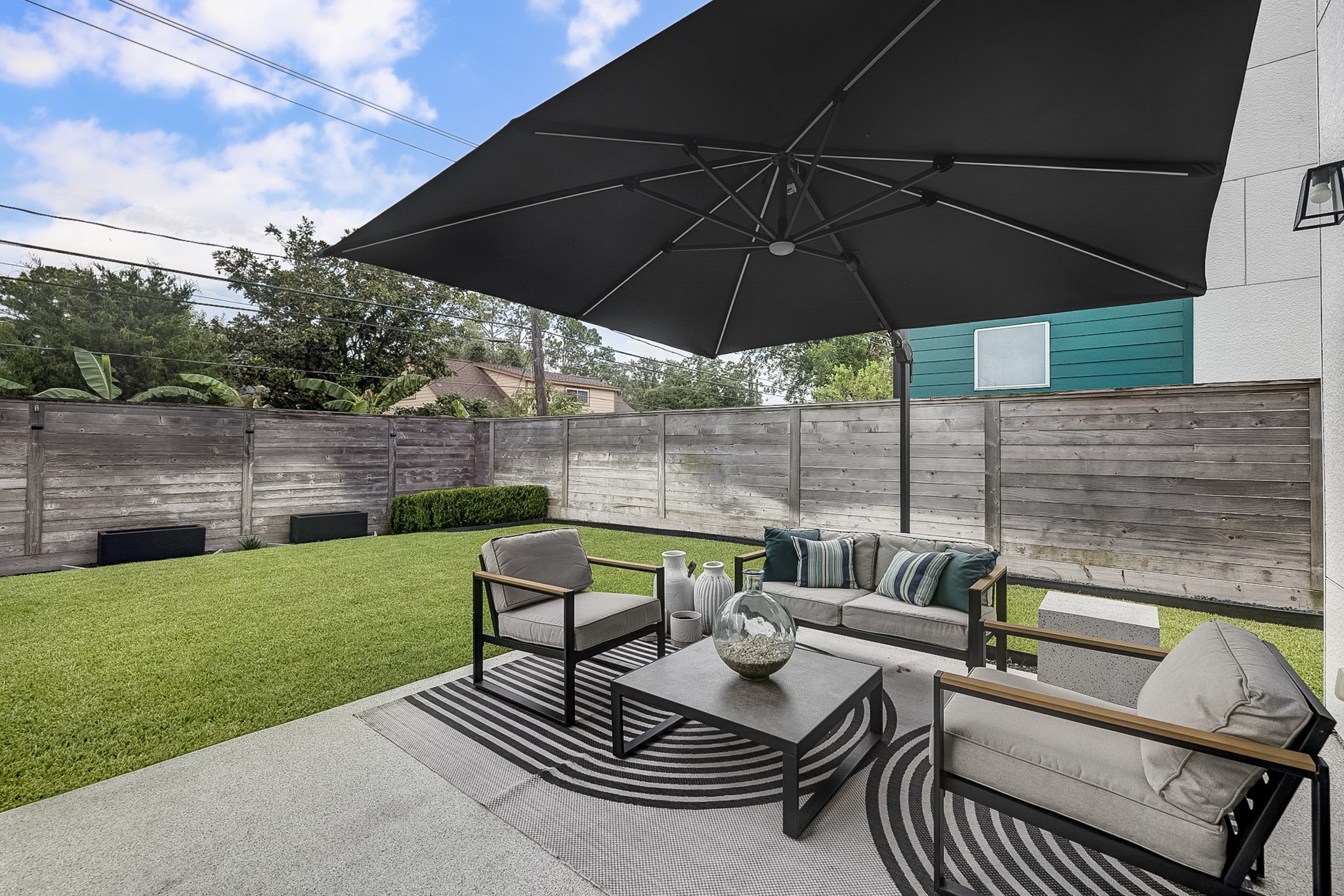 3306 Cardinal Crest Lane Houston, TX 77080 - Photo 47 of 50 an outdoor sitting area with furniture and umbrella