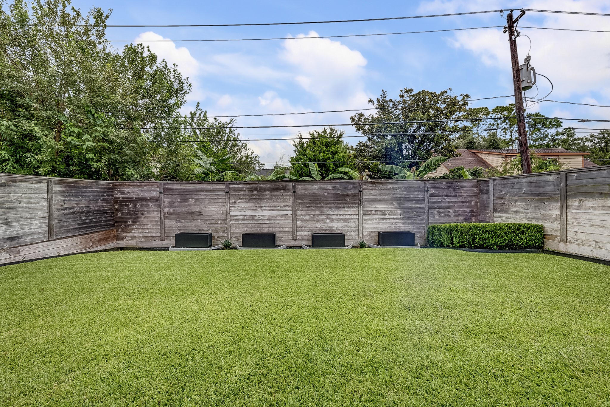 3306 Cardinal Crest Lane Houston, TX 77080 - Photo 49 of 50 a view of a backyard with plants and a bench