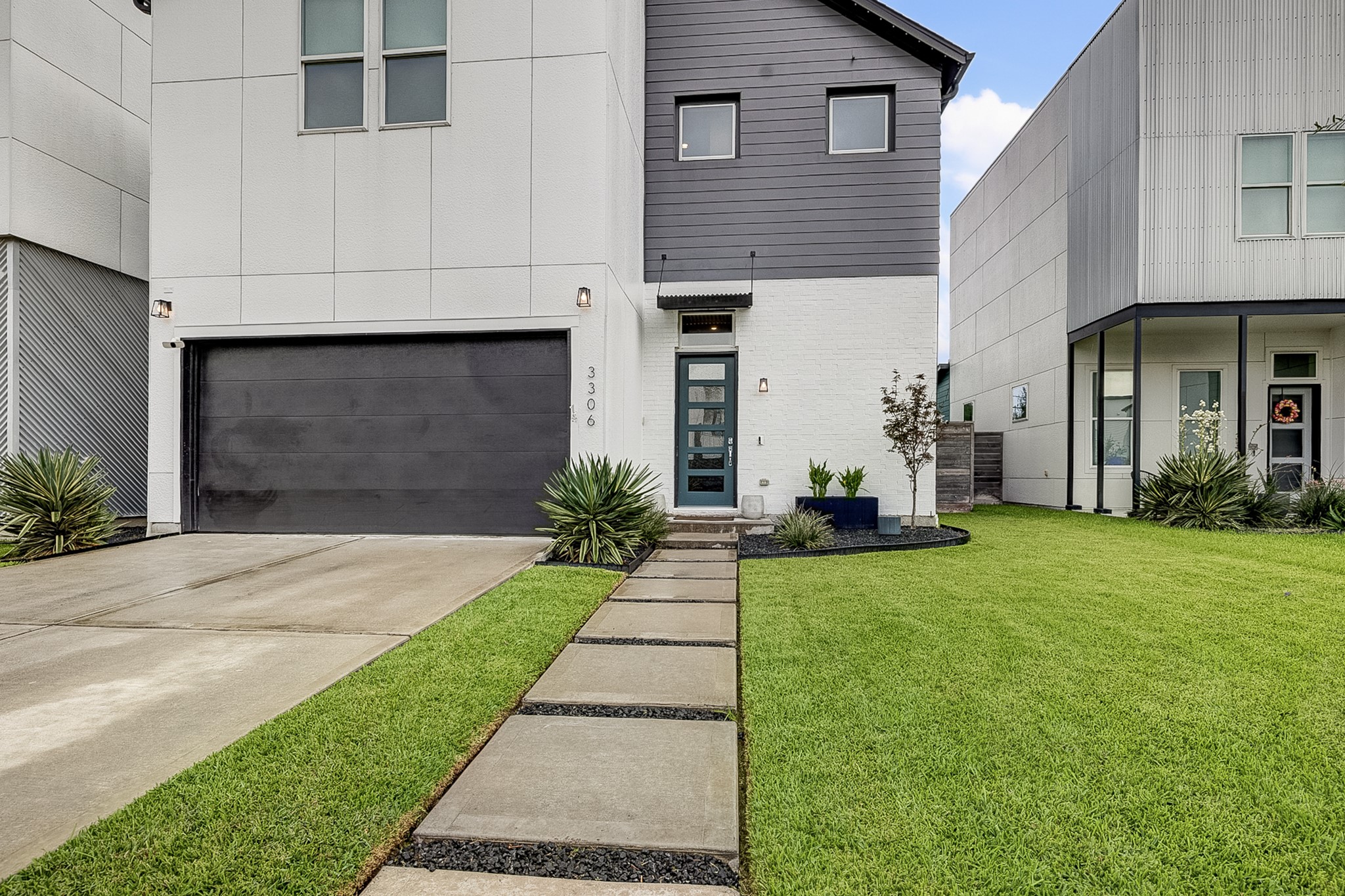 3306 Cardinal Crest Lane Houston, TX 77080 - Photo 8 of 50 a front view of a house with a yard and garage