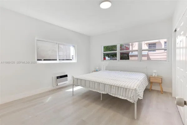 a bedroom with a bed and a table