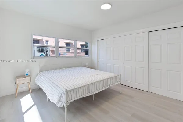 a bedroom with a bed and a cabinets