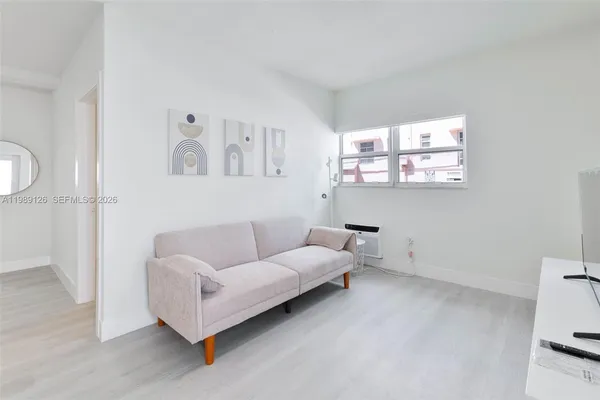 a living room with furniture and a window