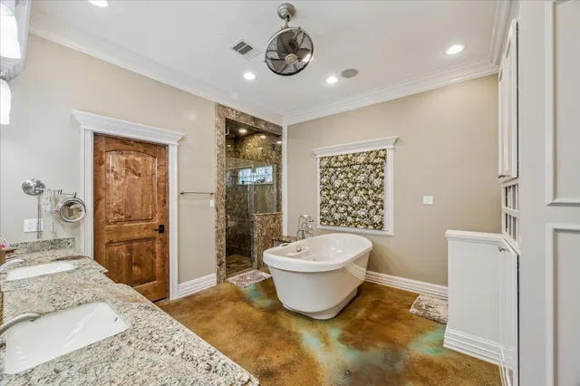 a bathroom with a bathtub sink and mirror