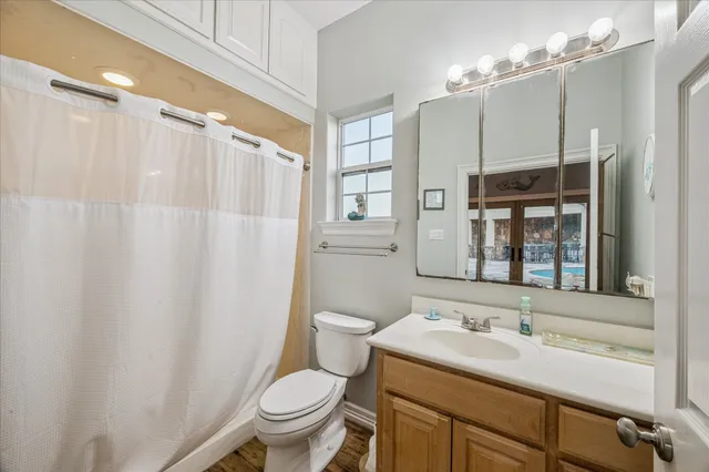 a view of a house with swimming pool and sitting area