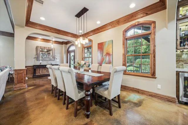 a view of a dining room with furniture window and outside view