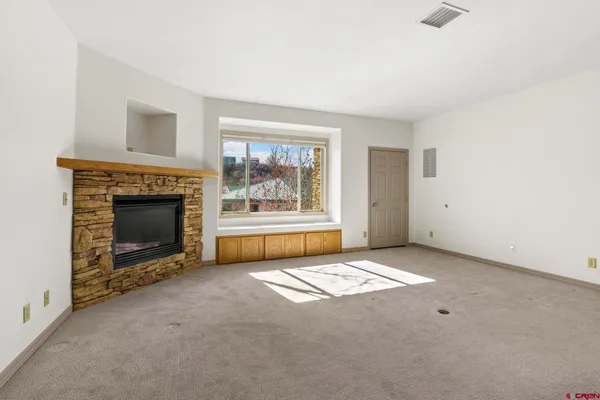 a living room with a fireplace