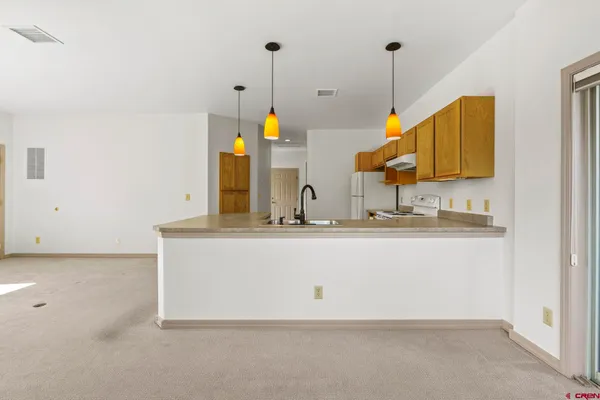 a view of a kitchen with furniture and window