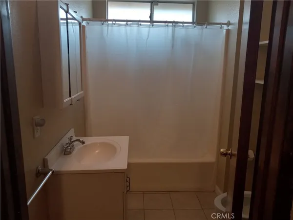 a bathroom with a sink and shower