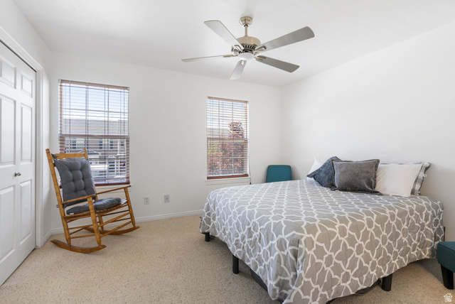 732 North 200 E Street Springville, UT 84663 - Photo 21 of 36 Carpeted room featuring two windows with horizontal blinds, a ceiling fan with brushed nickel accents, and a double-panel closet door