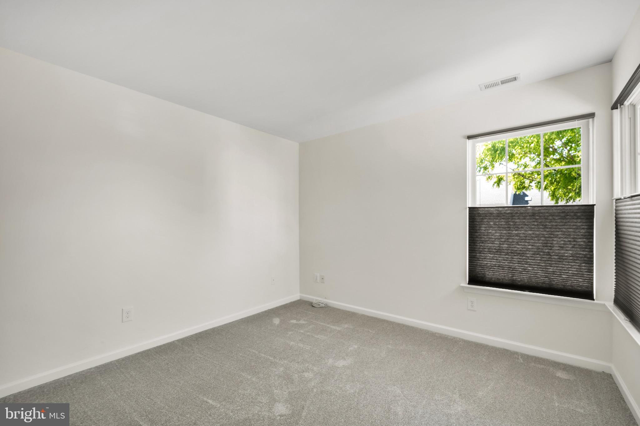 2402 Waterford Road, Unit 94 Yardley, PA 19067 - Photo 20 of 28 a view of an empty room with a window