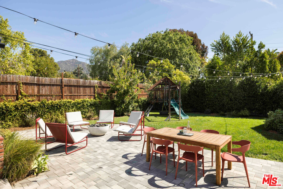 1410 Norton Avenue Glendale, CA 91202 - Photo 16 of 20 a view of backyard with seating space and trees in the background