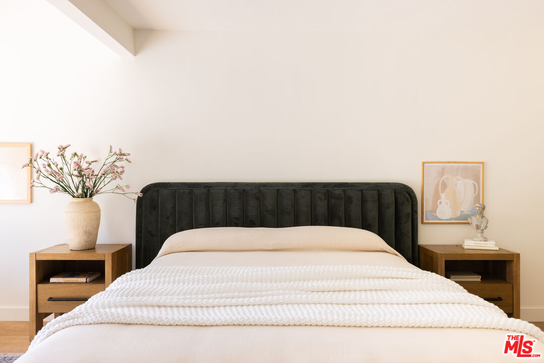 1410 Norton Avenue Glendale, CA 91202 - Photo 9 of 20 a bedroom with a bed and a chandelier