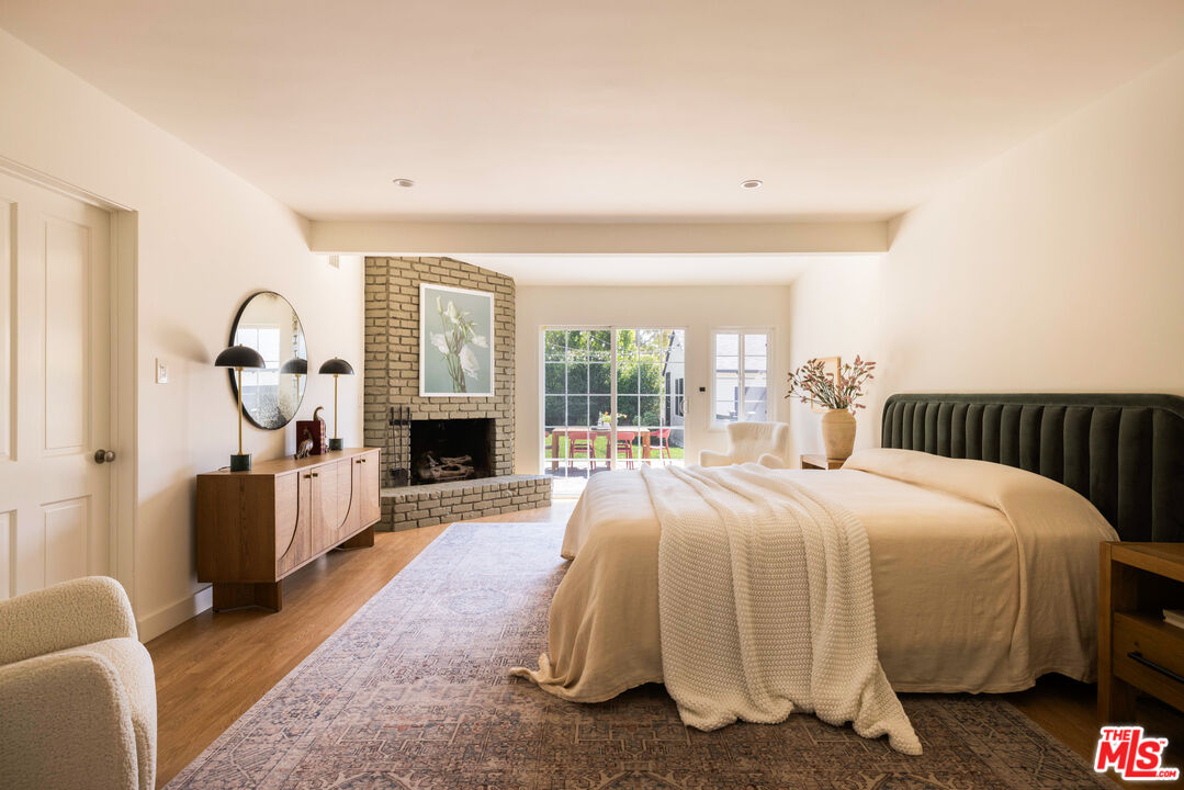 1410 Norton Avenue Glendale, CA 91202 - Photo 10 of 20 a bed room with a bed and a fireplace