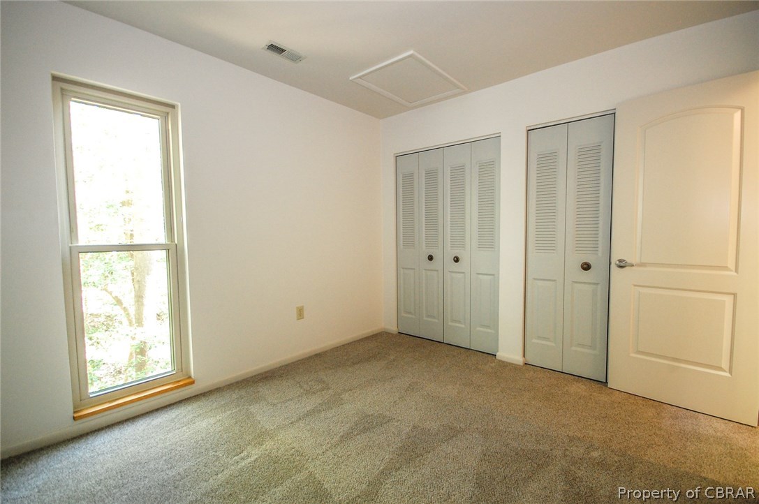 54 D Villa Ridge Drive, Unit D Hartfield, VA 23071 - Photo 13 of 34 ONE OF TWO SPACIOUS BEDROOMS ON 1ST FLOOR