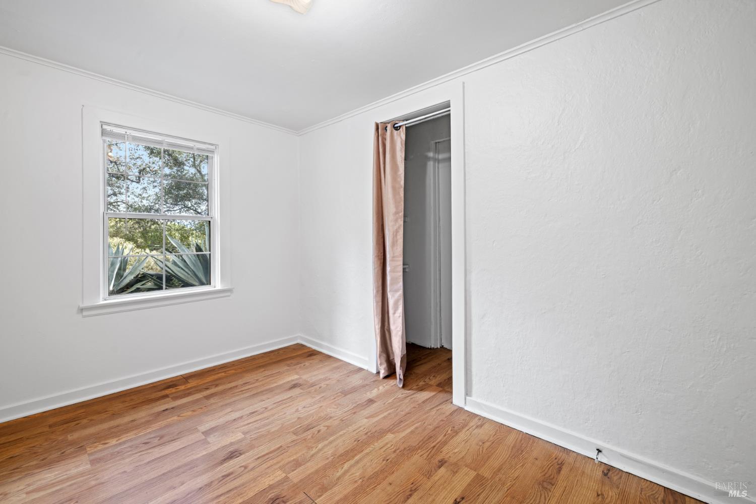 3160 Sunridge Drive Santa Rosa, CA 95404 - Photo 15 of 45 an empty room with wooden floor and window