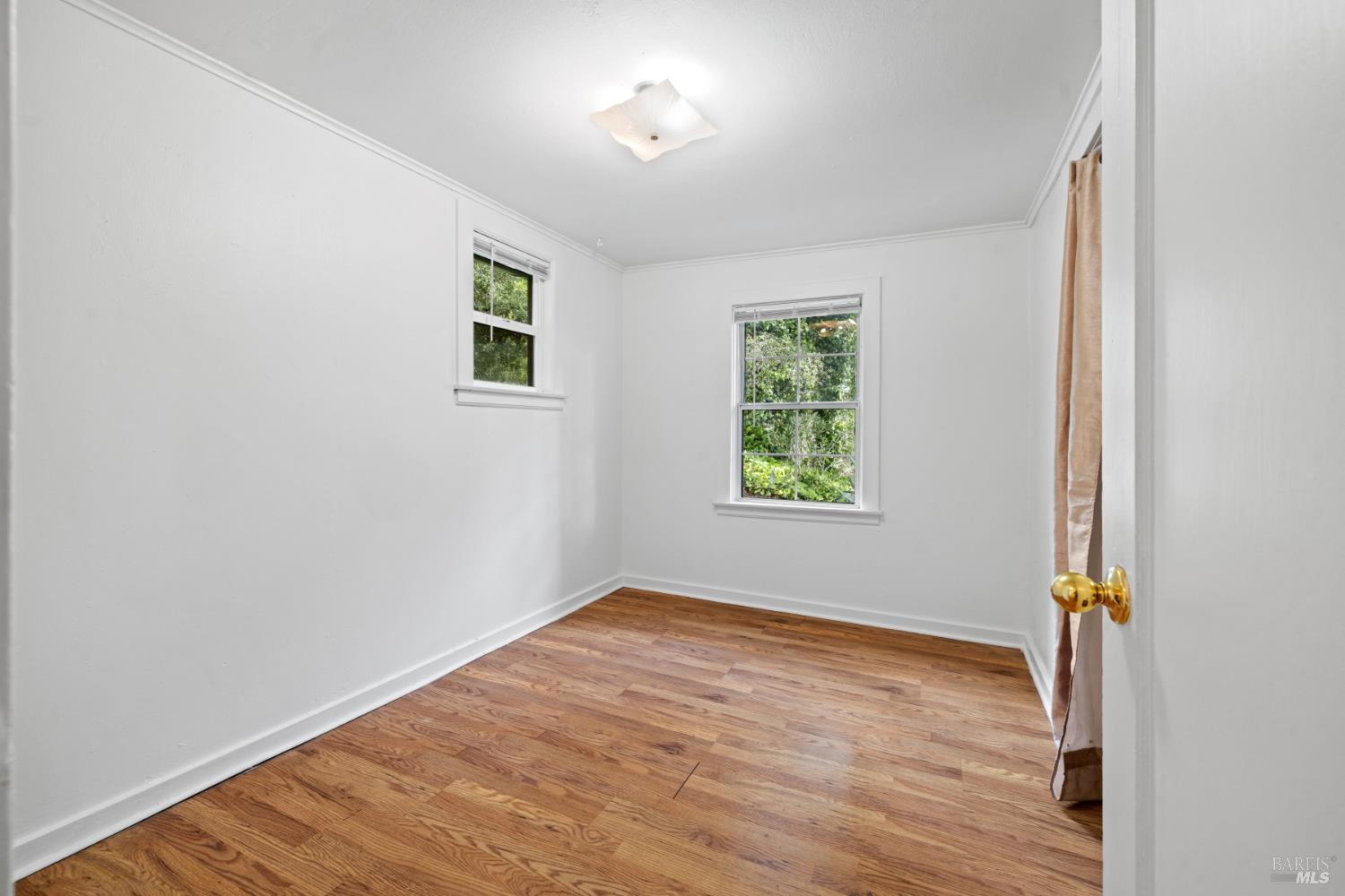 3160 Sunridge Drive Santa Rosa, CA 95404 - Photo 18 of 45 an empty room with wooden floor and windows