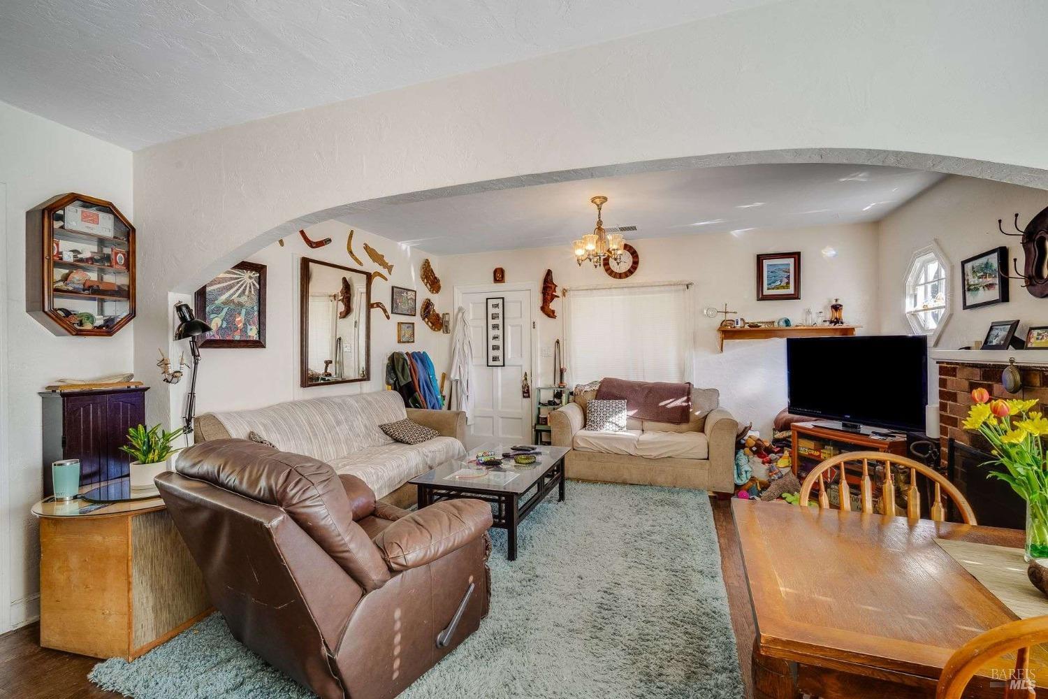 3160 Sunridge Drive Santa Rosa, CA 95404 - Photo 26 of 45 a living room with furniture kitchen view and a flat screen tv