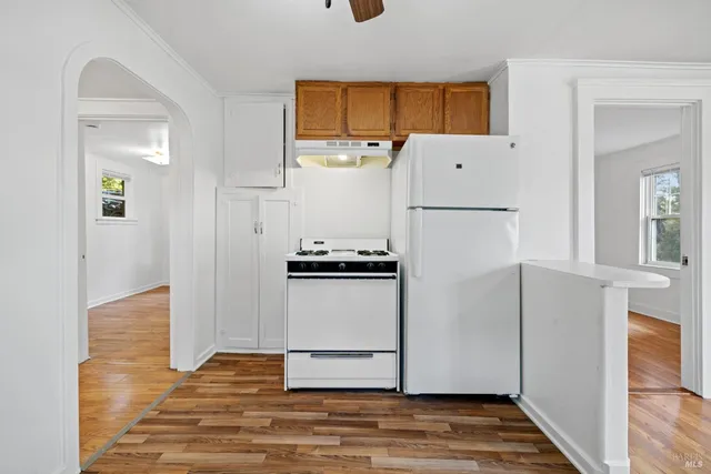 a view of kitchen with wooden floor