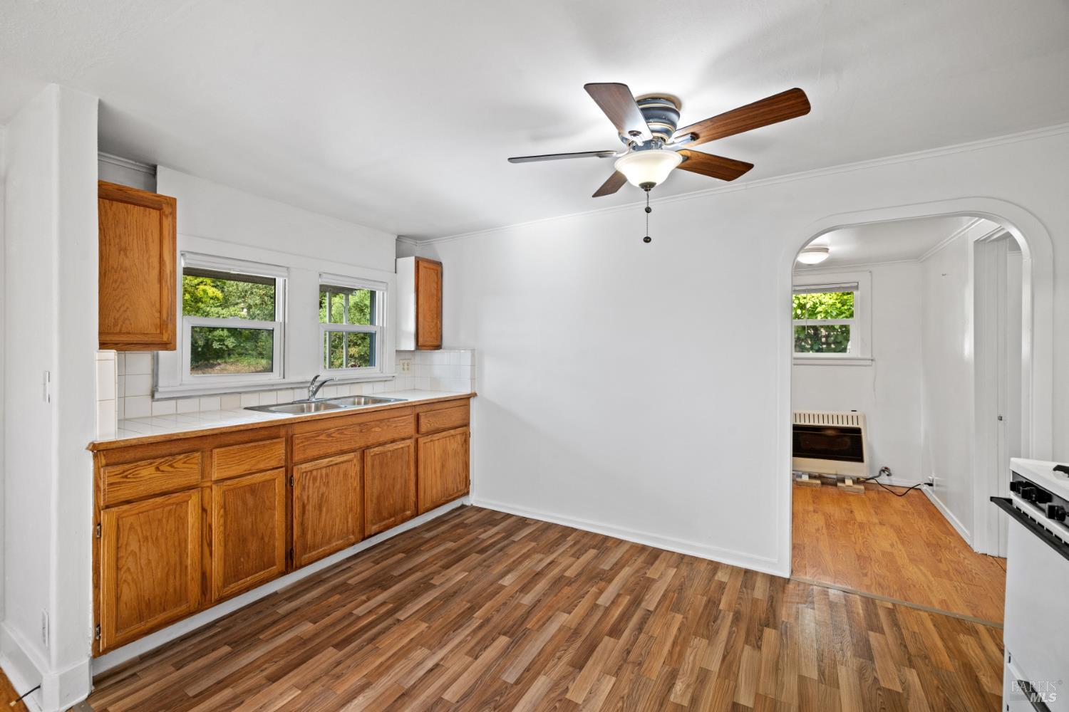 3160 Sunridge Drive Santa Rosa, CA 95404 - Photo 9 of 45 a kitchen with a refrigerator a sink and a window