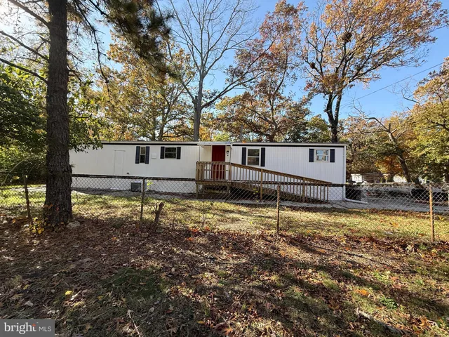 a house with trees in front of it