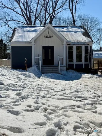 a house with trees in the background