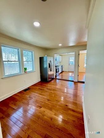 a view of livingroom with hardwood floor and hallway