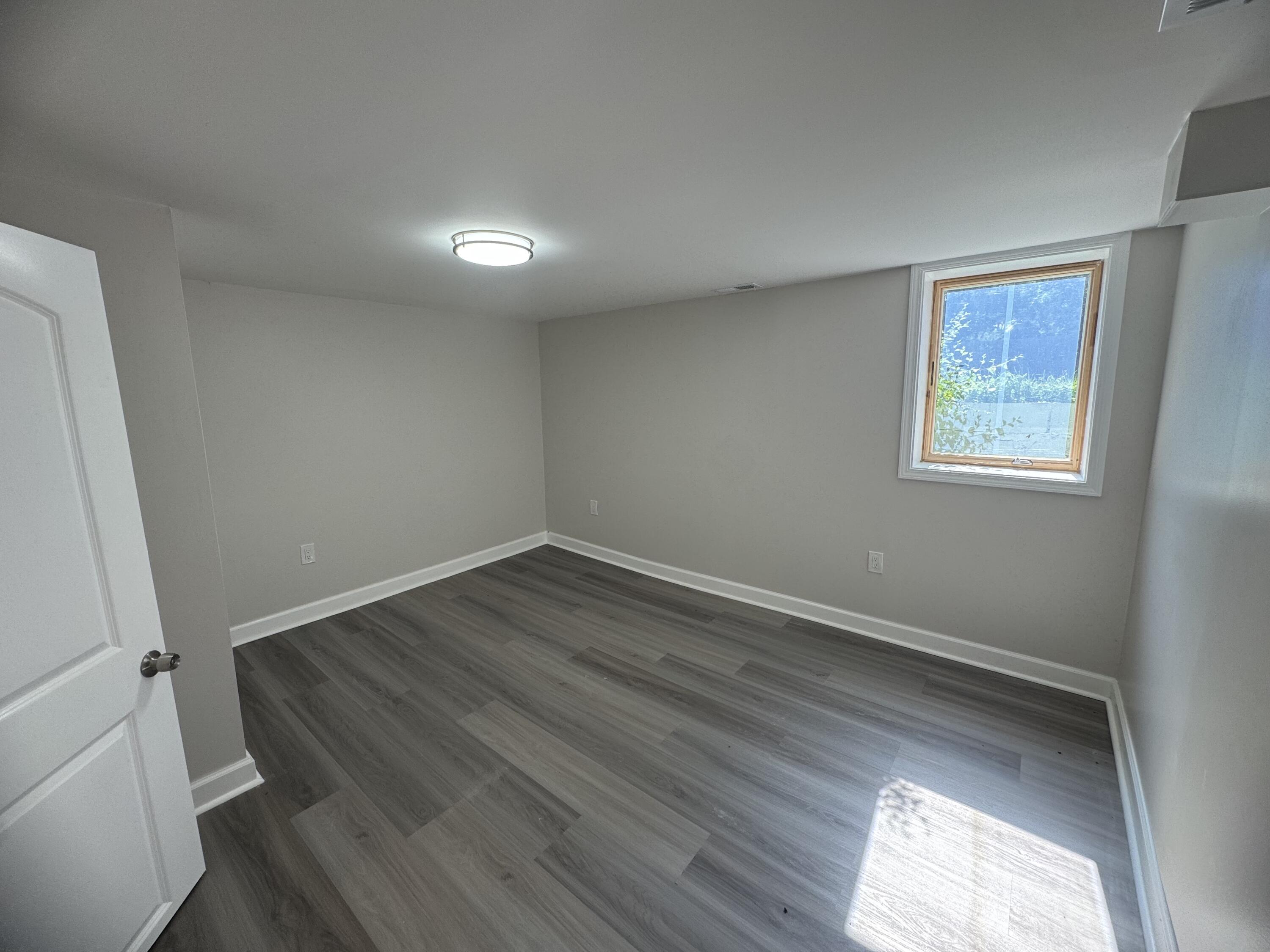 2344 Virginia Street Gary, IN 46407 - Photo 9 of 13 an empty room with wooden floor and windows