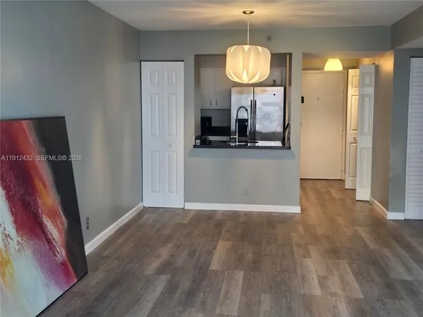 a view of a living room and wooden floor