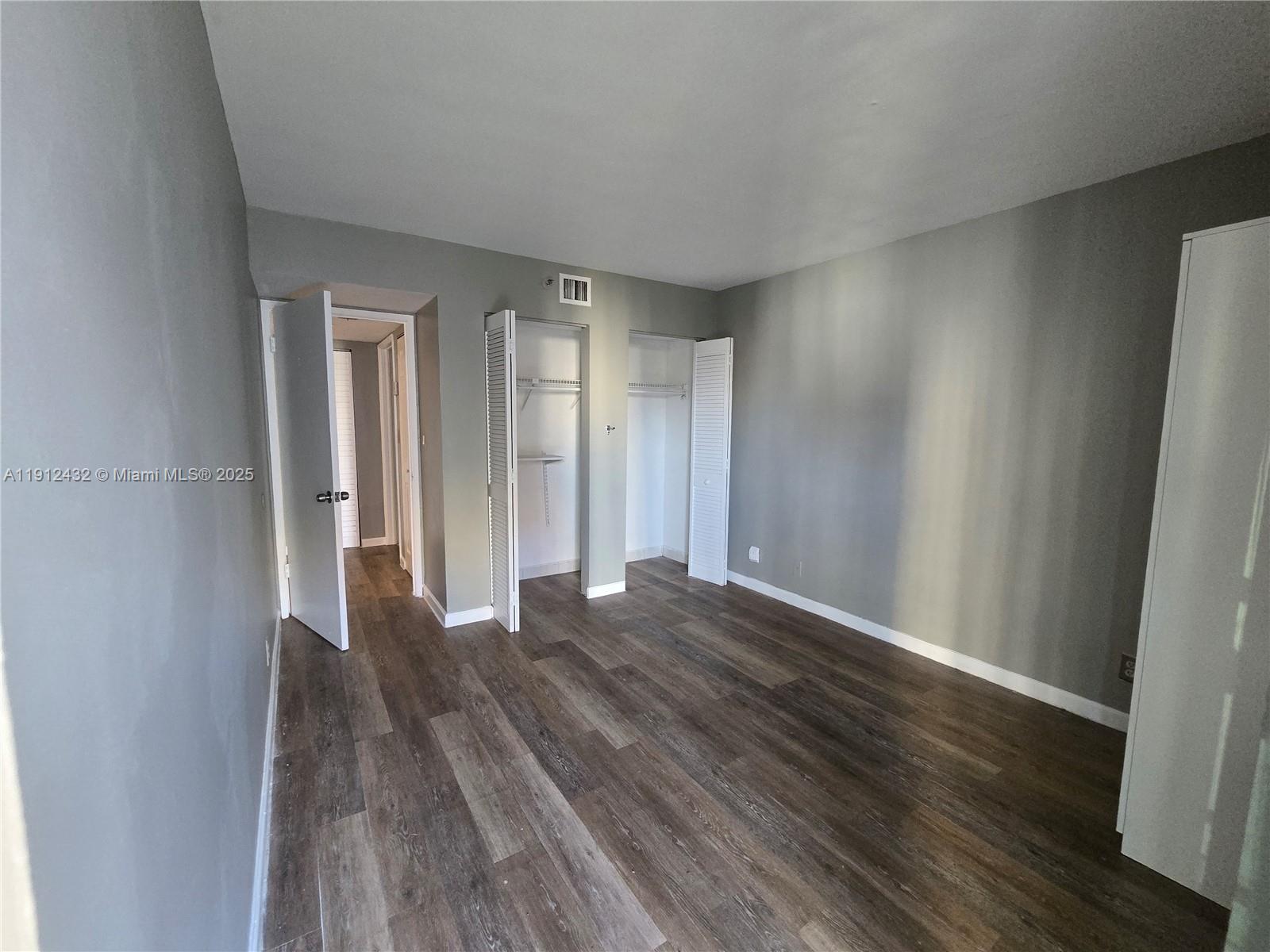 546 Southwest 1st Street, Unit 612 Miami, FL 33130 - Photo 6 of 20 a view of an empty room with wooden floor