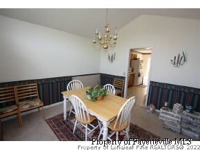 1890 Tingen Road Lillington, NC 27546 - Photo 5 of 12 a view of a dining room with furniture and wooden floor