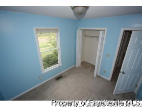 1890 Tingen Road Lillington, NC 27546 - Photo 6 of 12 a view of an empty room with a window