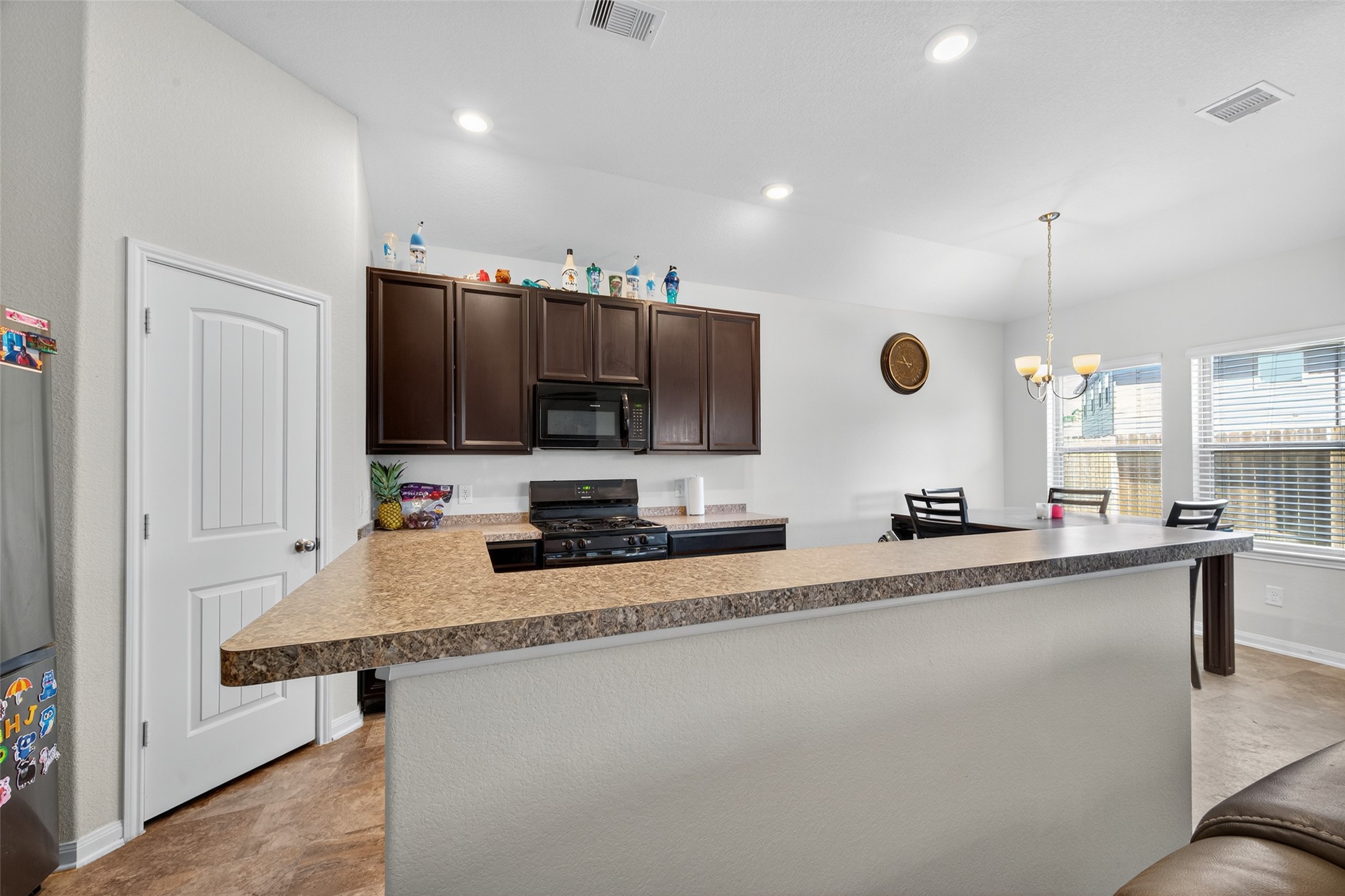 7615 Nevaeh Crest Path Houston, TX 77016 - Photo 14 of 37 a kitchen with stainless steel appliances a sink and a refrigerator