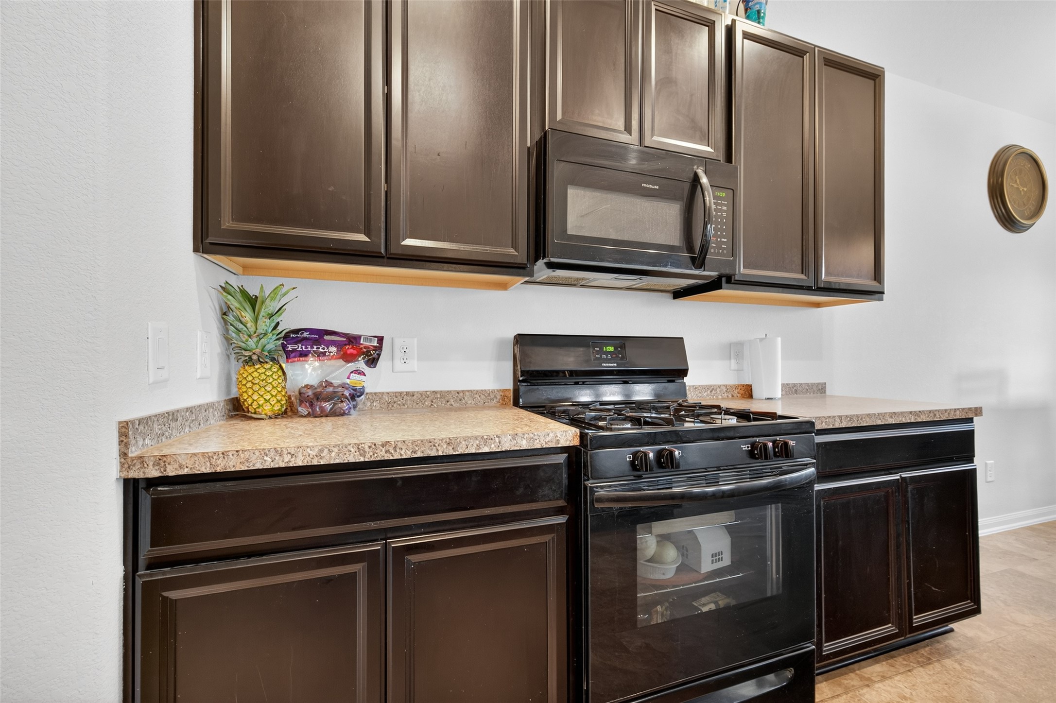 7615 Nevaeh Crest Path Houston, TX 77016 - Photo 18 of 37 a kitchen with stainless steel appliances granite countertop a stove microwave and sink