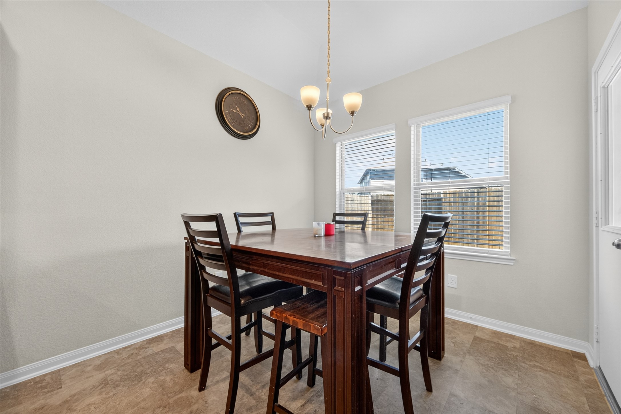 7615 Nevaeh Crest Path Houston, TX 77016 - Photo 22 of 37 a view of a dining room and a table and chairs