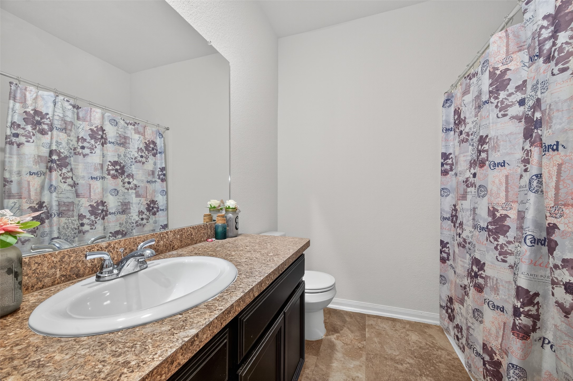 7615 Nevaeh Crest Path Houston, TX 77016 - Photo 24 of 37 a bathroom with a sink and a mirror
