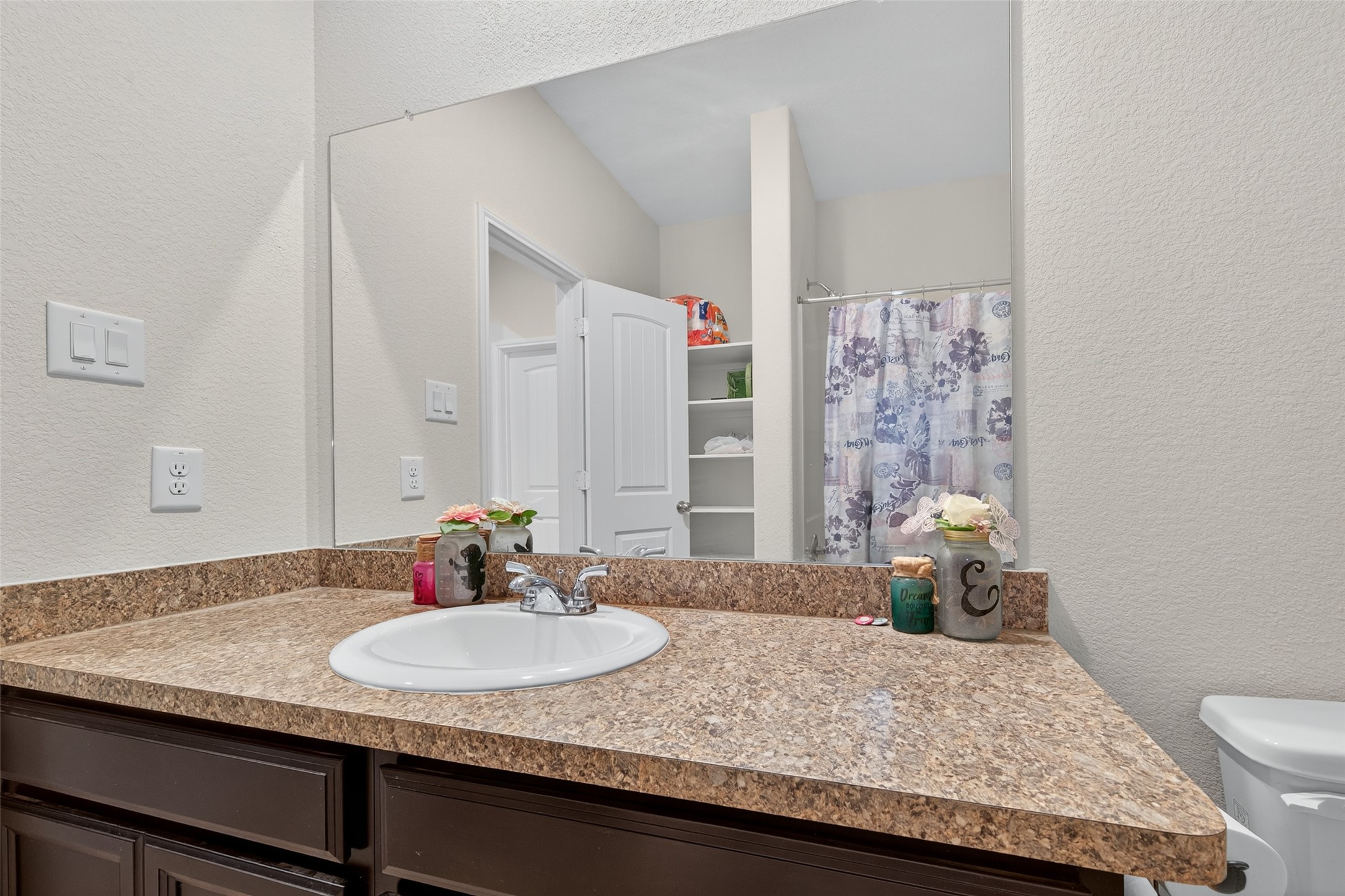 7615 Nevaeh Crest Path Houston, TX 77016 - Photo 25 of 37 a bathroom with a granite countertop sink a toilet and shower