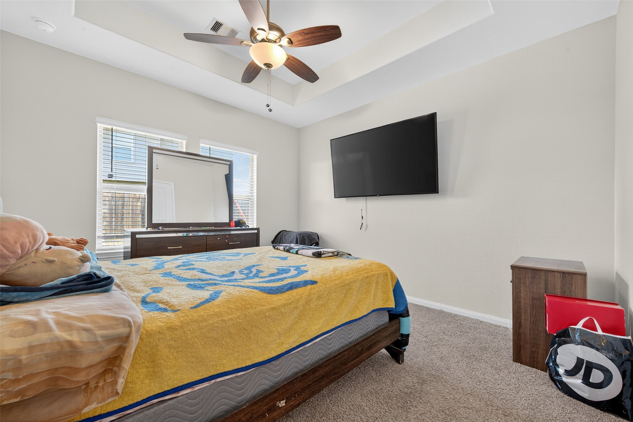 7615 Nevaeh Crest Path Houston, TX 77016 - Photo 27 of 37 a bedroom with a bed and a flat screen tv