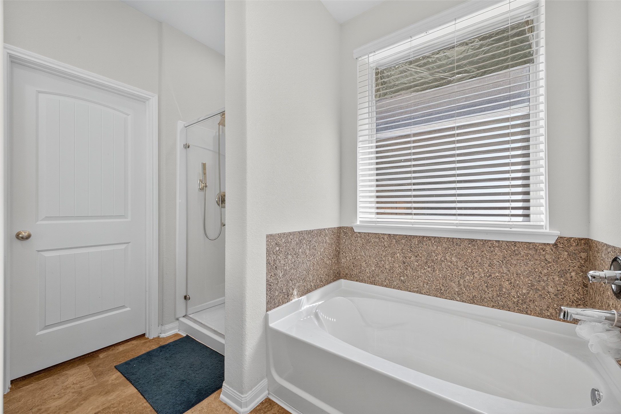 7615 Nevaeh Crest Path Houston, TX 77016 - Photo 29 of 37 a bathroom with a bathtub and a shower