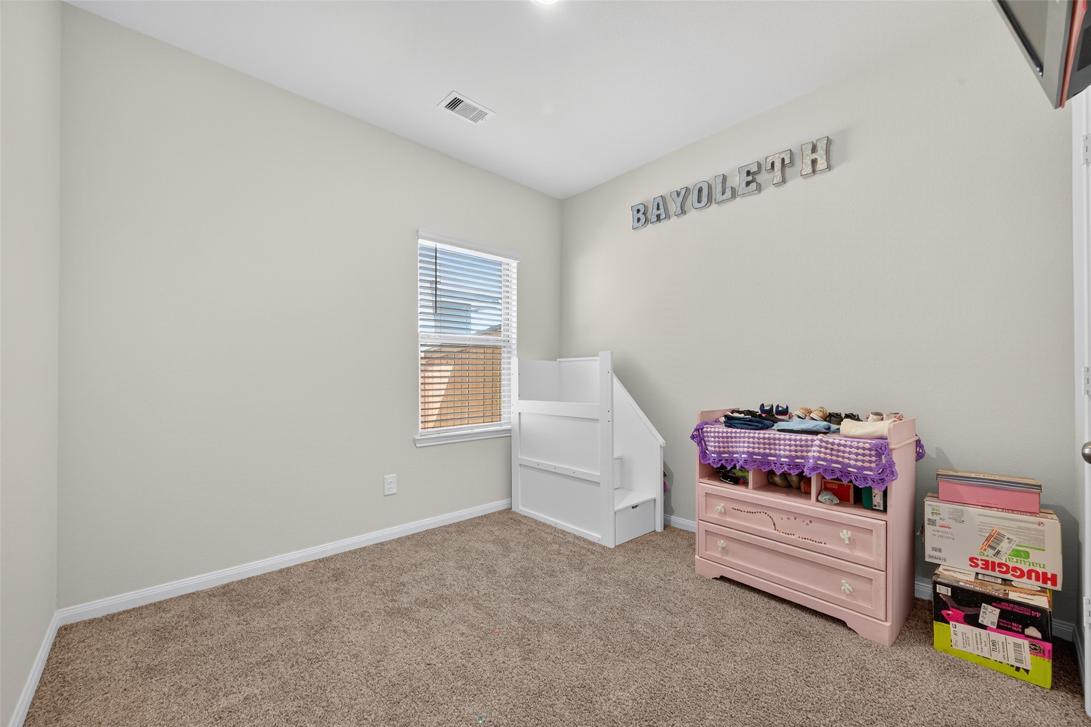 7615 Nevaeh Crest Path Houston, TX 77016 - Photo 32 of 37 a bedroom with furniture and a window