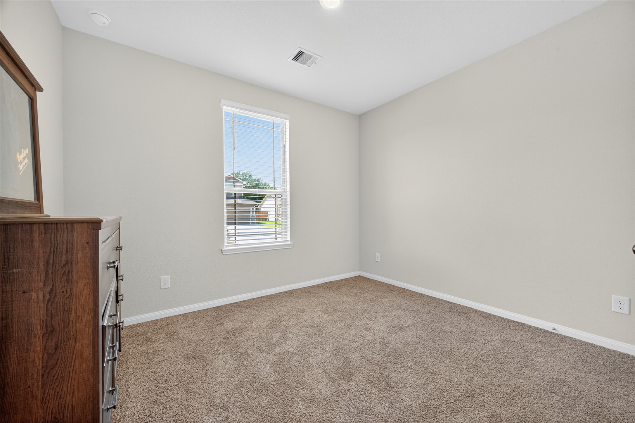 7615 Nevaeh Crest Path Houston, TX 77016 - Photo 34 of 37 a view of an empty room with a window