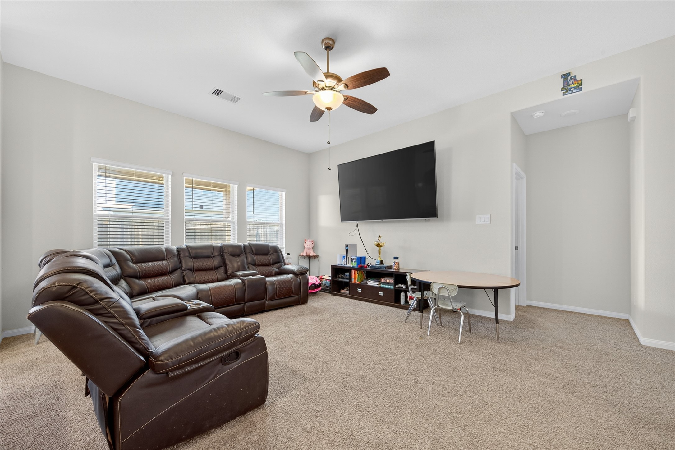 7615 Nevaeh Crest Path Houston, TX 77016 - Photo 8 of 37 a living room with furniture and a flat screen tv