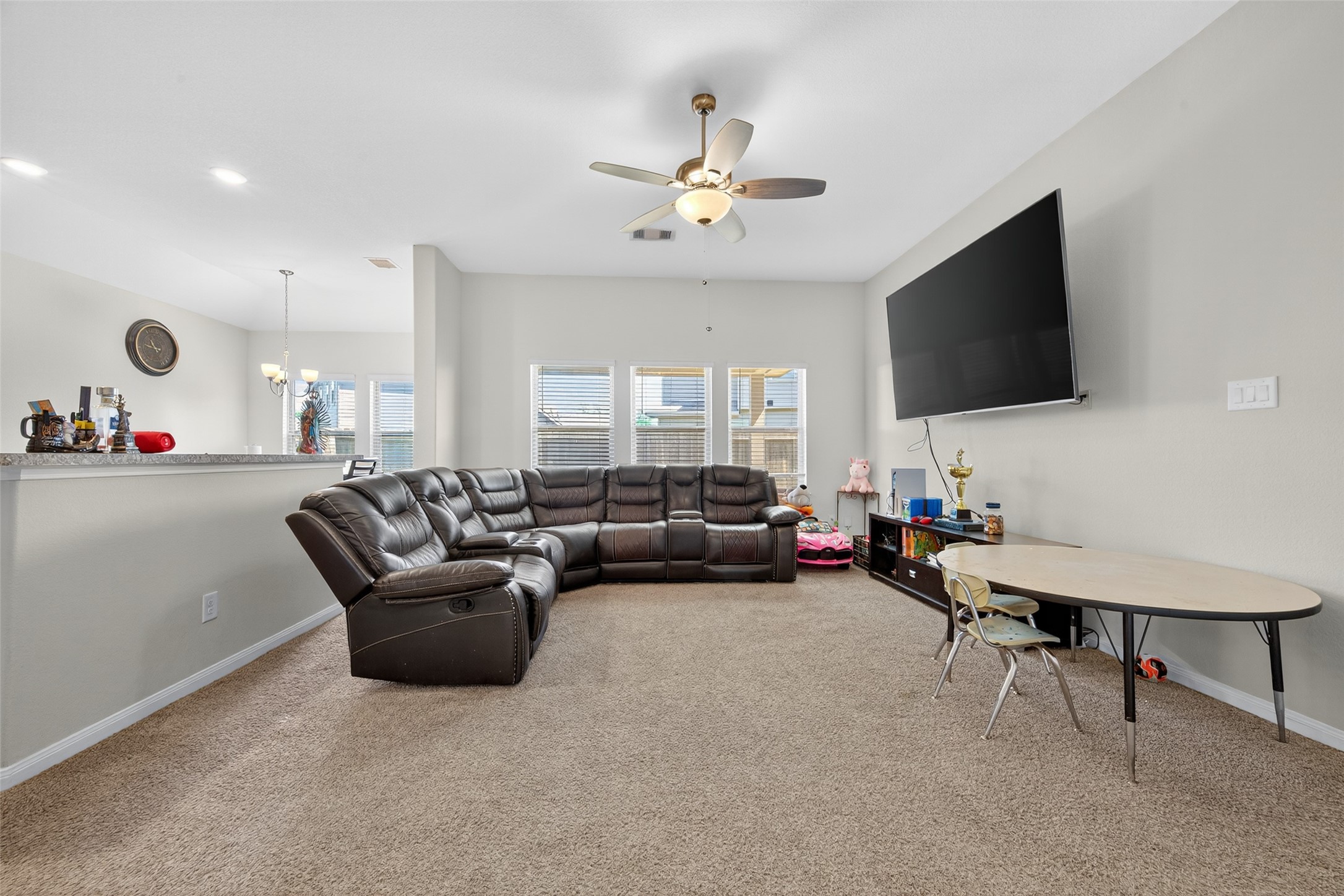 7615 Nevaeh Crest Path Houston, TX 77016 - Photo 9 of 37 a living room with furniture and a flat screen tv