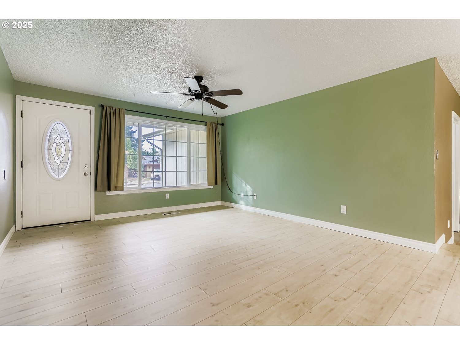 120 Northwest Giese Avenue Gresham, OR 97030 - Photo 4 of 17 a view of an empty room with a window