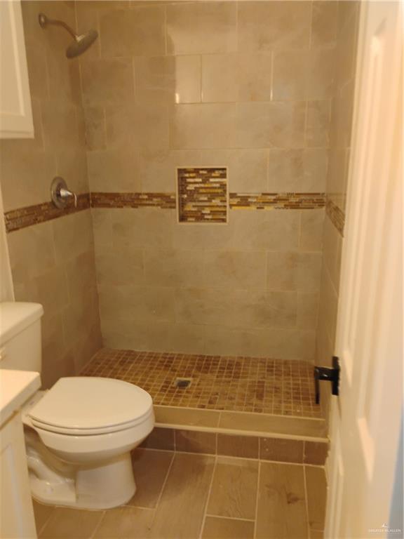2114 Monterrey Hidalgo, TX 78557 - Photo 16 of 17 a bathroom with a toilet and a shower