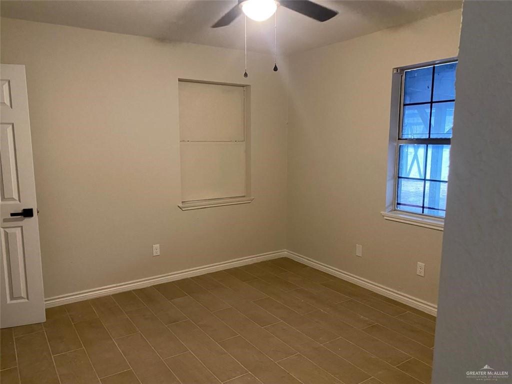 2114 Monterrey Hidalgo, TX 78557 - Photo 9 of 17 an empty room with a empty space and a window