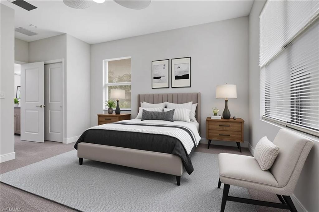 7501 Carnegie Way Naples, FL 34119 - Photo 33 of 37 Carpeted bedroom with ensuite bathroom and ceiling fan