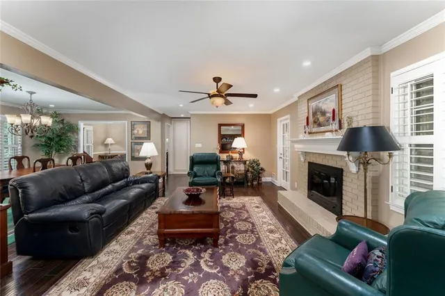 a living room with furniture fireplace and window